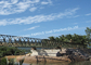 Geprefabriceerde het Staalbrug van Vestingmuur voor Brug van het het Project de Draagbare Structurele Staal van de Watermilieubescherming met het Steunen van Pijlers leverancier